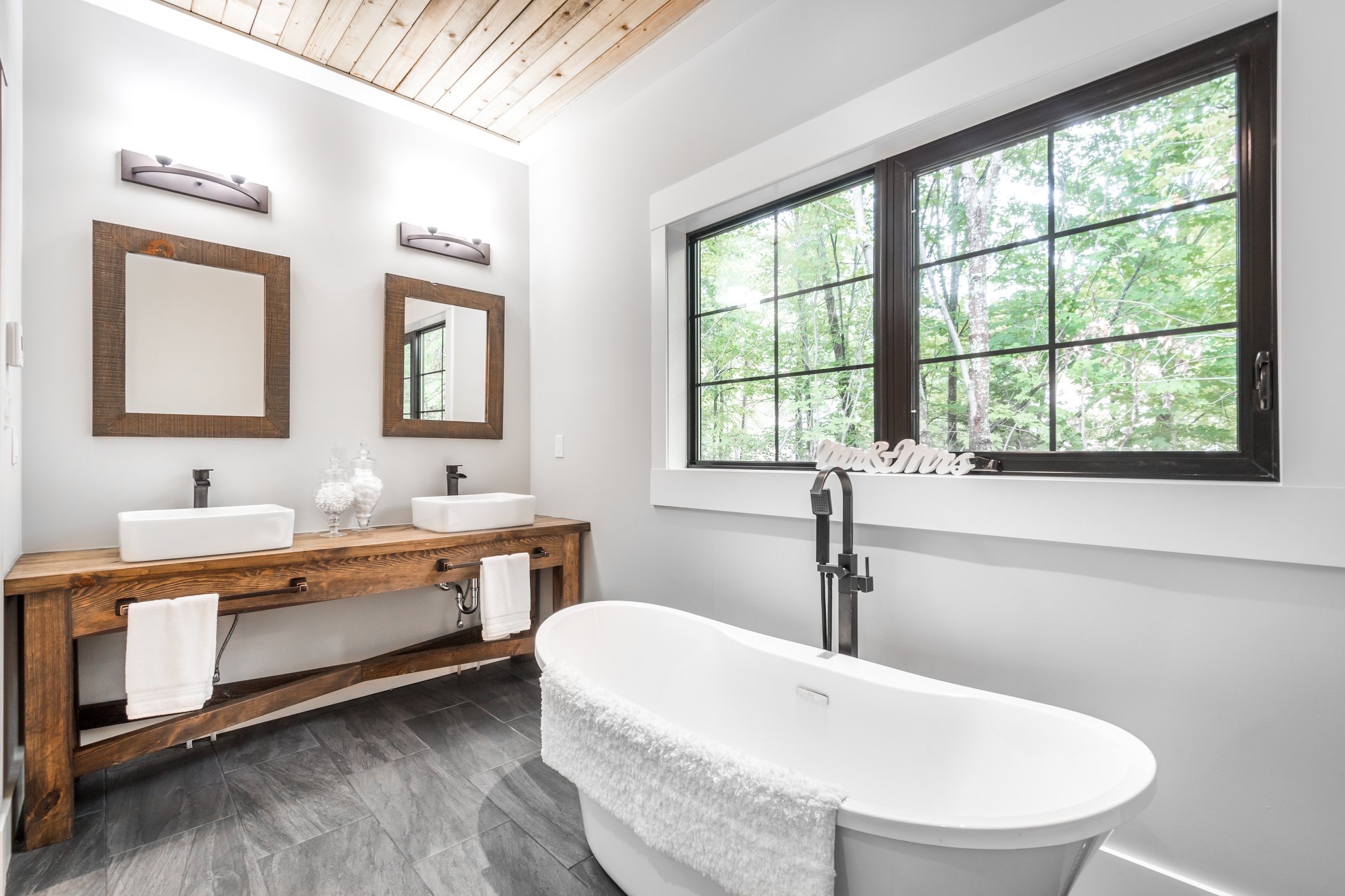 interior, bathroom, dual sinks, two sinks, his and hers, soaking tub, windows